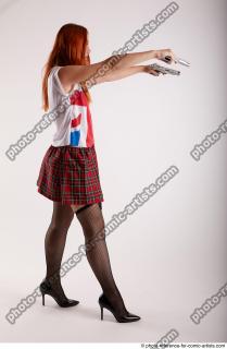 TINA STANDING POSE WITH TWO GUNS 